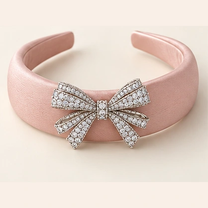 Vivienne Bow, blush satin and a silver-tone cubic zirconia bow